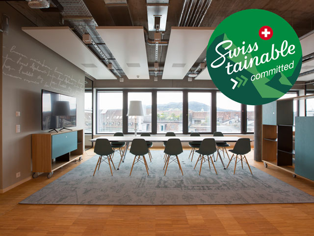 Welle7 Workspace mit swisstainable Logo